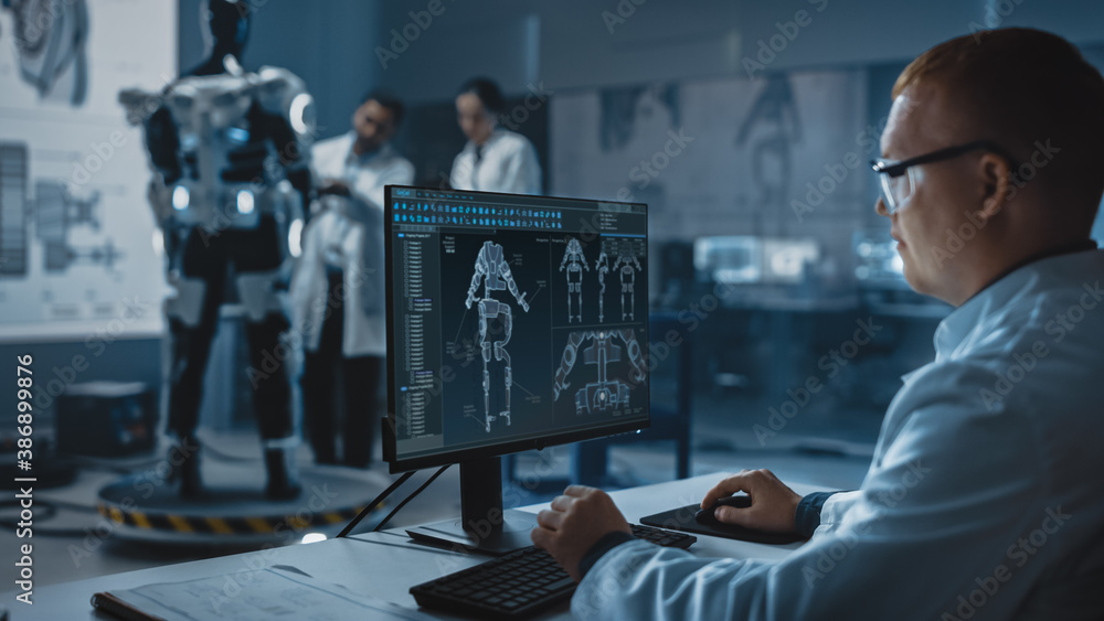 Leinwandbilder In Robotics Development Laboratory: Chief Analyst Uses Computer for Designing Powered Exosuit to Help Disabled People. Top Engeneers and Scientists Work on Bionics Exoskeleton Prototype.