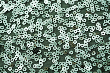 Circle green sequins on green fabric