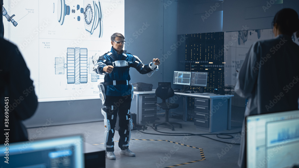 Poster in development laboratory: engineers and scientists look at robotics exoskeleton prototype presentat