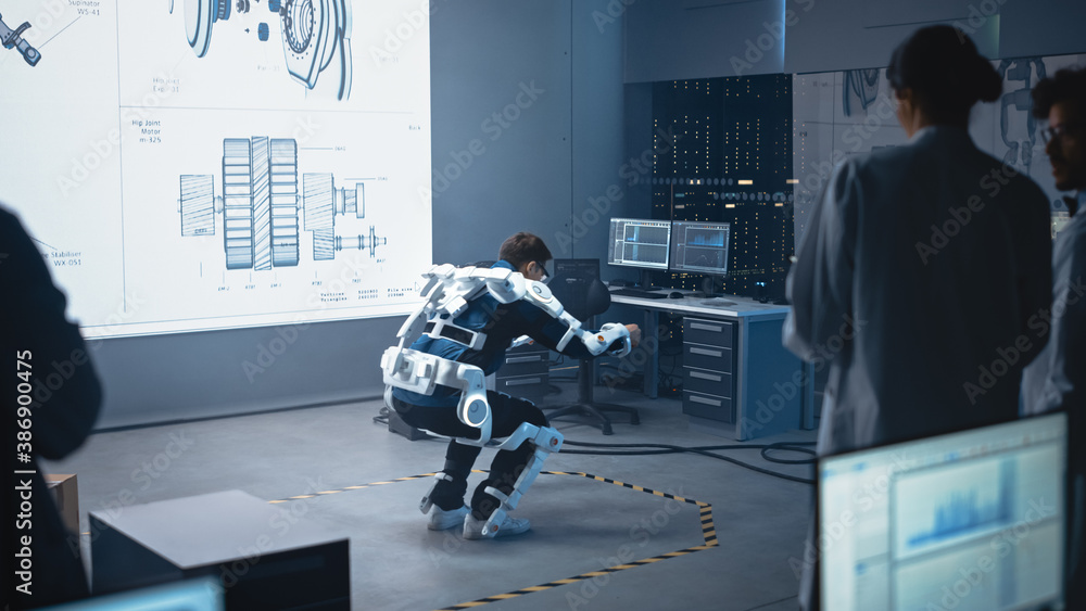 Poster in development laboratory: engineers and scientists look at robotics exoskeleton prototype presentat
