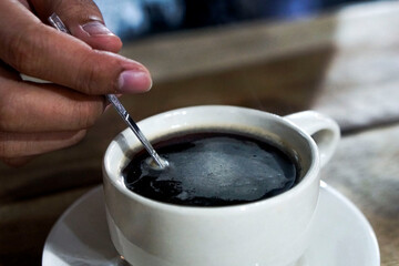 pouring coffee into cup