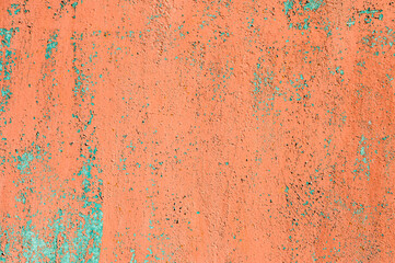 Textured background old faded red paint with white streaks and cracked peeling to rusty metal