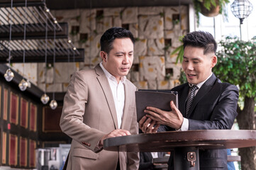 businessman talk business deal at skyscraper office lounge with cityscape business zone background