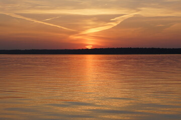 Obraz premium sunset over the river