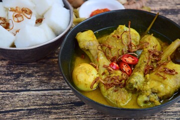 Opor ayam, chicken cooked in coconut milk from Indonesia, from Central Java, added with boiled...