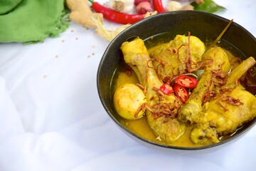 Opor ayam, chicken cooked in coconut milk from Indonesia, from Central Java, added with boiled eggs. Popular dish for lebaran or Eid al-Fitr