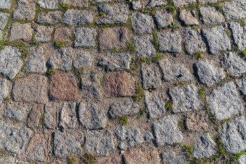 The texture of the rough granite stone.