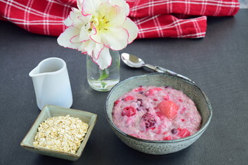 Oatmeal porridge with blueberry, raspberries, blackberry, strawberry and red currants. Healthy diet breakfast