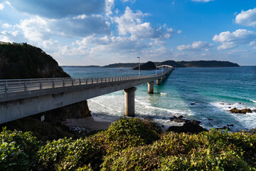 bridge crosses the sea to the island in Japan.
