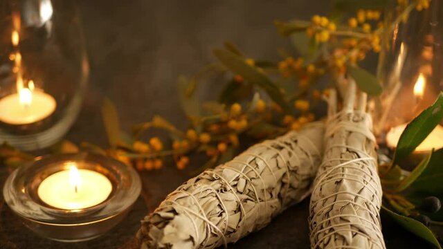 Dried white sage smudge stick, relaxation and aromatherapy. Smudging during psychic occult ceremony, herbal healing, yoga or aura cleaning. Essential incense for esoteric rituals and fortune telling.