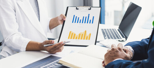 Job meeting between a business woman boss and a male finance worker.