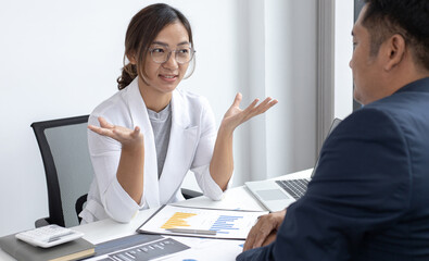 Job meeting between a business woman boss and a male finance worker.