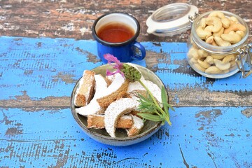 kue Putri salju (snow princess cookies or snow white cookies) is cute crescent shaped vanilla...