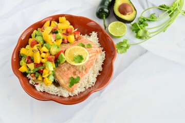 Baked salmon with coconut rice and mango salsa