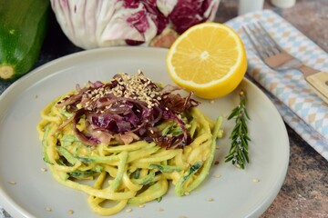 Zucchini noodle or zoodles with tahini sauce and sauteed radicchio