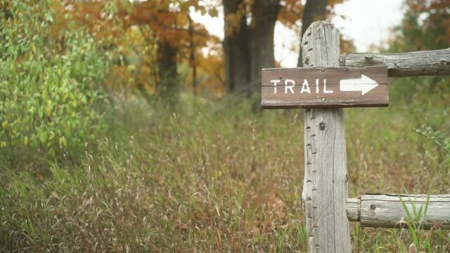 Wooden Hiking Trail Sign Pointing Forward In Autumn Fall