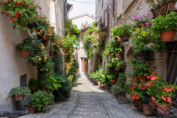 Charming floral decorated streets of medieval towns of Italy. Spello in Umbria