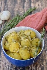 Boiled potato with onion, garlic and rosemary