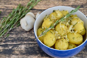 Boiled potato with onion, garlic and rosemary