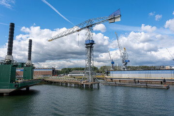 Obraz premium Floating dry dock with cranes in the port of rotterdam, the Netherlands