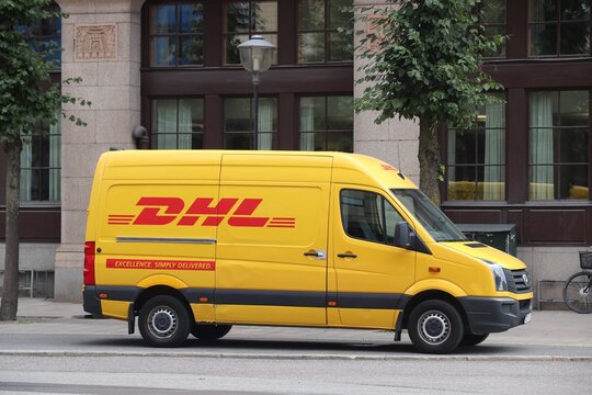 STOCKHOLM, SWEDEN - AUGUST 23, 2018:  DHL courier delivery van in Stockholm. DHL is part of German national mail service - Deutsche Post.