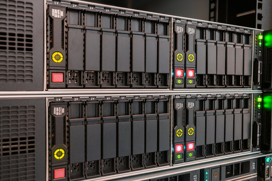 There is a close-up of the data storage server. The powerful database server has many slots for hard drives. Modern computer equipment of the data center.