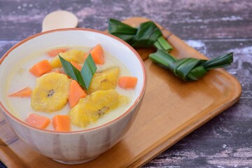 Indonesian Food - Kolak Pisang Ubi, Plantain banana and sweet potato, cooked in coconut milk, palm sugar and pandanus leaves