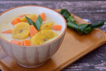 Indonesian Food - Kolak Pisang Ubi, Plantain banana and sweet potato, cooked in coconut milk, palm sugar and pandanus leaves