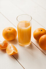 Glass of 100% Orange juice with pulp and sliced fruits isolate on white background.Be cut to remove the orange juice to drink and eat and be healthy.