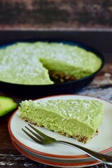 Homemade vegan avocado lime coconut pie. Raw food cake