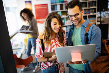 Group of college students studying in the school library