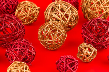 Christmas wooden colorful balls on red background.