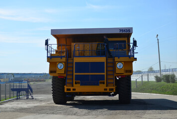 Giant mining dump truck, after being discharged from the conveyor, is tested at the factory test site. Heavy-duty truck manufacture by the heavy vehicle plant.