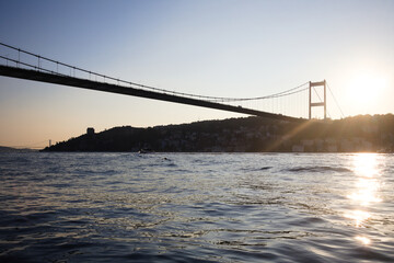 istanbul bosphorus from the sea during sunset under fatih sultan mehmet bridge
