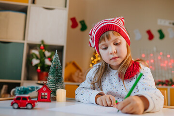 Little girl writing a letter to Santa