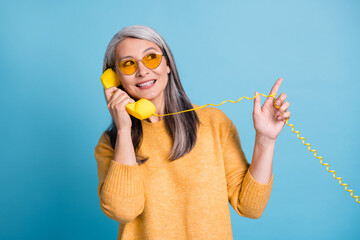 Photo of pretty charming aged woman calling friend ask new supermarket opened their street direct...
