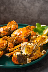 angle view crabs with one opened showing the crab roe and meat vertical composition