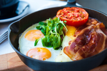 classical english breakfast with egg and ham