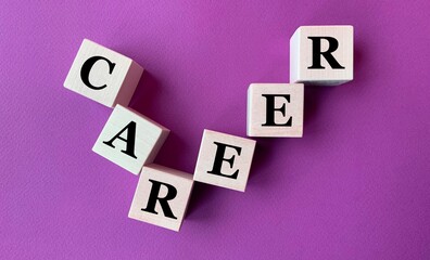 The word career on wooden cubes on a purple background.Photo for business .Career ladder made of...