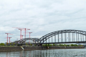 Fototapeta na wymiar Railroad Bridge and Cranes Frankfurt Germany 