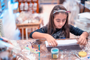 Fototapeta premium Young girl making diy work at home