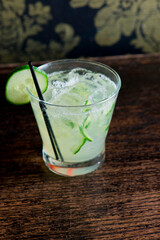 Cocktails. Traditional American drinks made by artisanal bartenders or mixologists in speakeasy & upscale bars or dives or taverns.Cocktails served in chilled cocktail glasses & garnished with fruit.