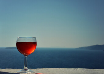 Glass of Red Wine with the Aegean Sea in the Background