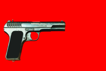 WWII German army handgun on red background.