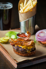 Cheese Burger. Classic American favorite cuisine. Hamburger with jalapenos , grilled mushrooms and melted cheeses and served with hand cut french fries. 