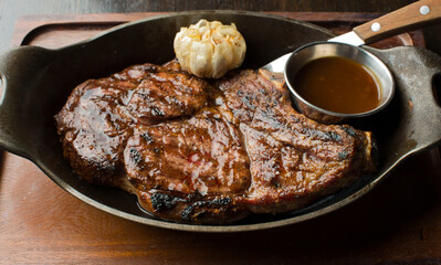 Steak. Grass-fed skirt steak, grilled to a medium rare and served with a garlic herb butter sauce and paired with roasted potatoes and Brussels sprouts. Classic American steakhouse favorite.