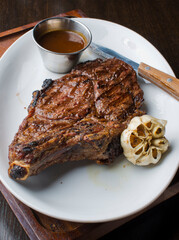 Steak. Grass-fed skirt steak, grilled to a medium rare and served with a garlic herb butter sauce and paired with roasted potatoes and Brussels sprouts. Classic American steakhouse favorite.