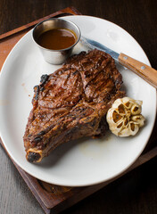 Steak. Grass-fed skirt steak, grilled to a medium rare and served with a garlic herb butter sauce and paired with roasted potatoes and Brussels sprouts. Classic American steakhouse favorite.