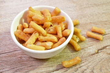 mini crispy fried Chinese dough in cup on table