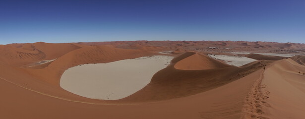 Fototapeta na wymiar Desert view from top of Big Dad dune in Namibia. Salt lake view in the desert.
